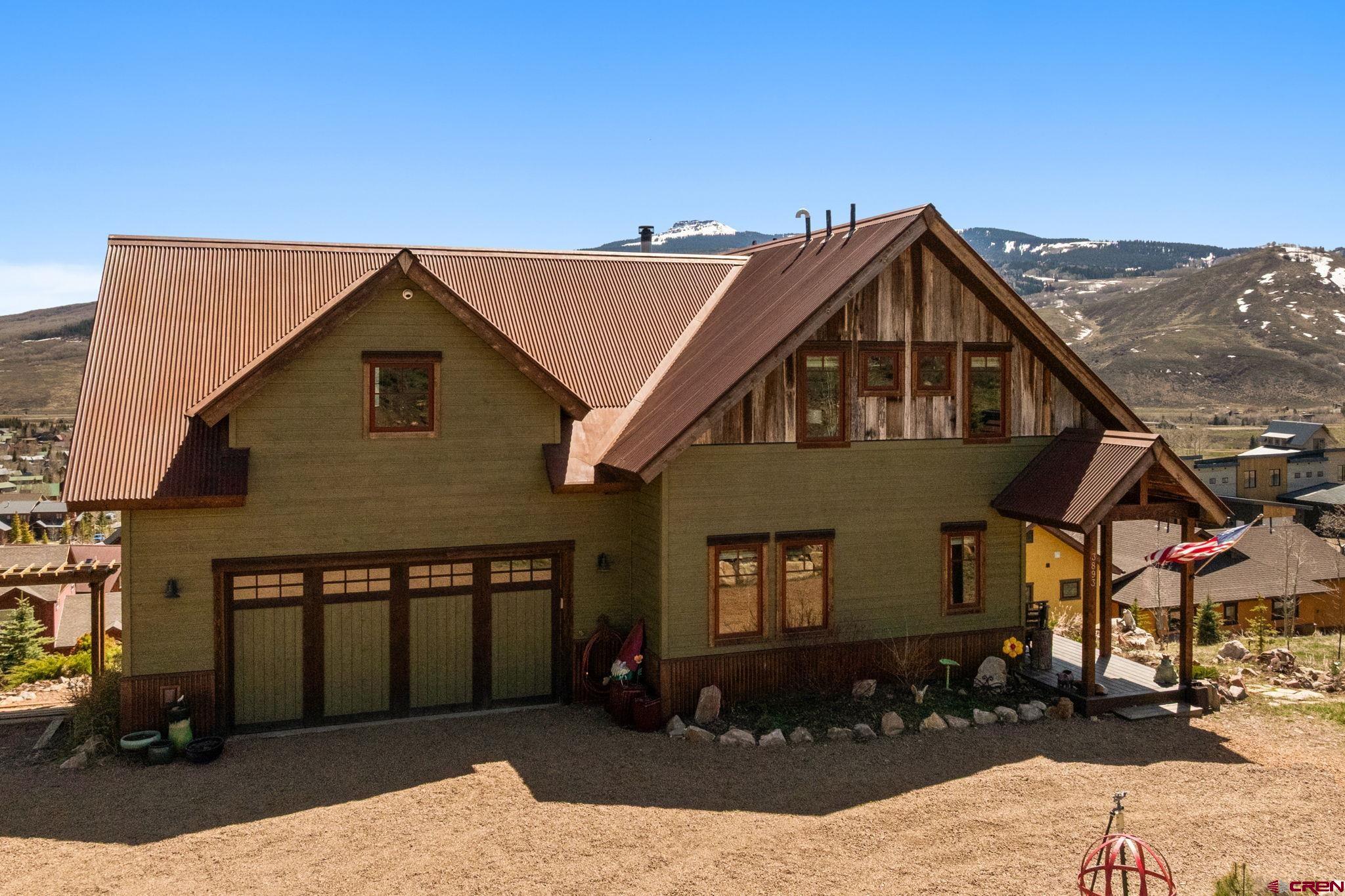 3893 Bryant Avenue Crested Butte, CO 81224 - Photo 3 of 45 a front view of a house with a yard