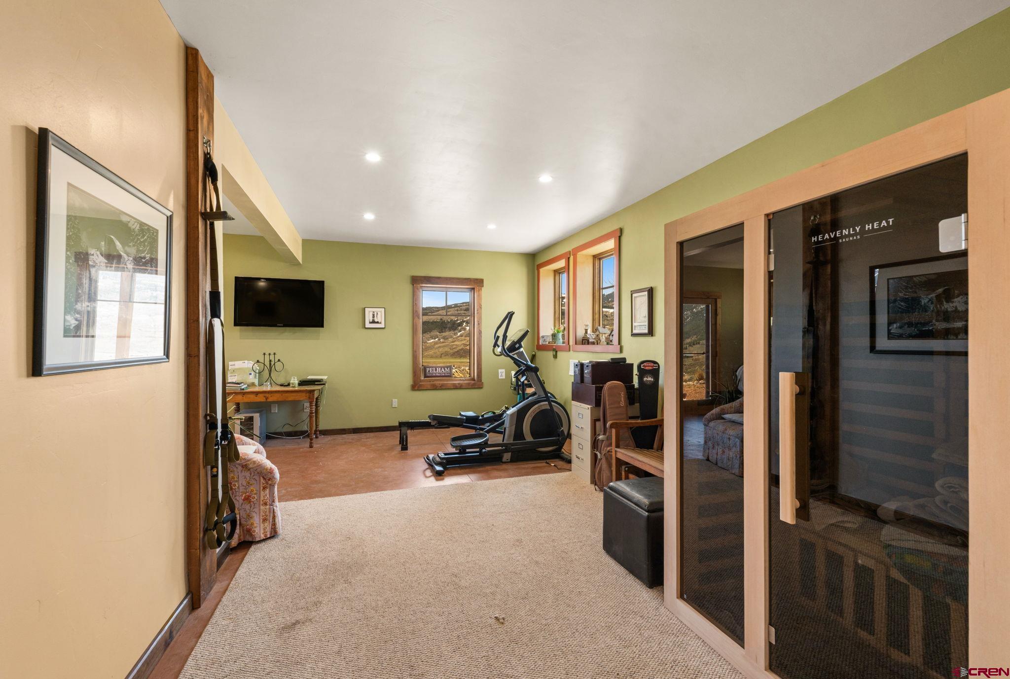 3893 Bryant Avenue Crested Butte, CO 81224 - Photo 34 of 45 a view of a living room with furniture and a flat screen tv