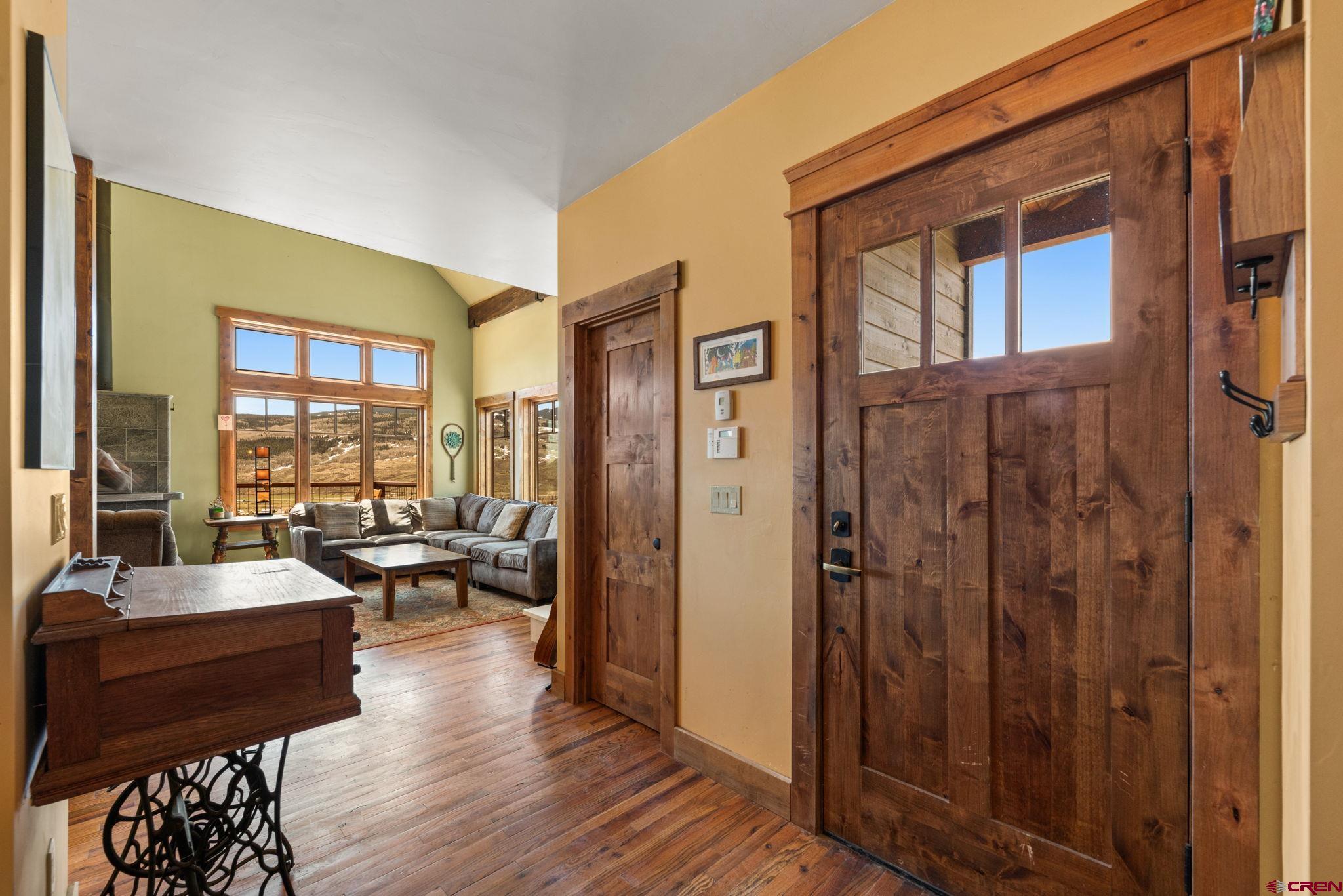 3893 Bryant Avenue Crested Butte, CO 81224 - Photo 4 of 45 a living room with furniture large window and wooden floor