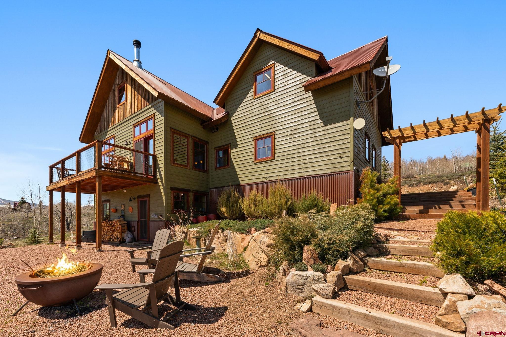 3893 Bryant Avenue Crested Butte, CO 81224 - Photo 42 of 45 a view of a chairs and tables in the patio