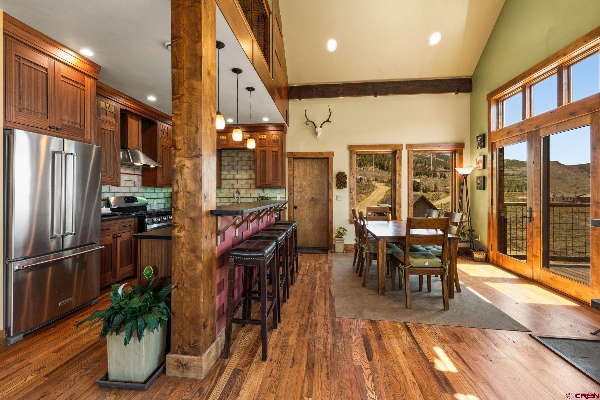 3893 Bryant Avenue Crested Butte, CO 81224 - Photo 9 of 45 a view of a dining room with furniture window and outside view
