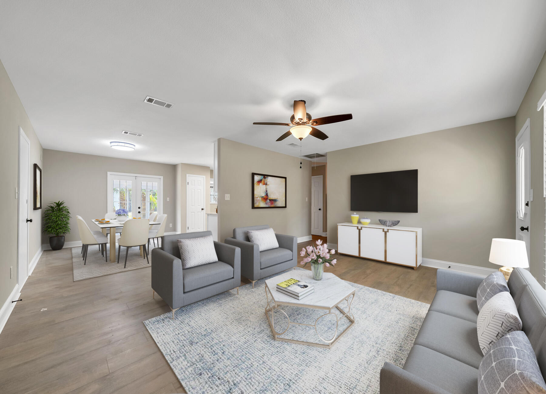 6935 Jasper Street Navarre, FL 32566 - Photo 2 of 45 a living room with furniture and a flat screen tv