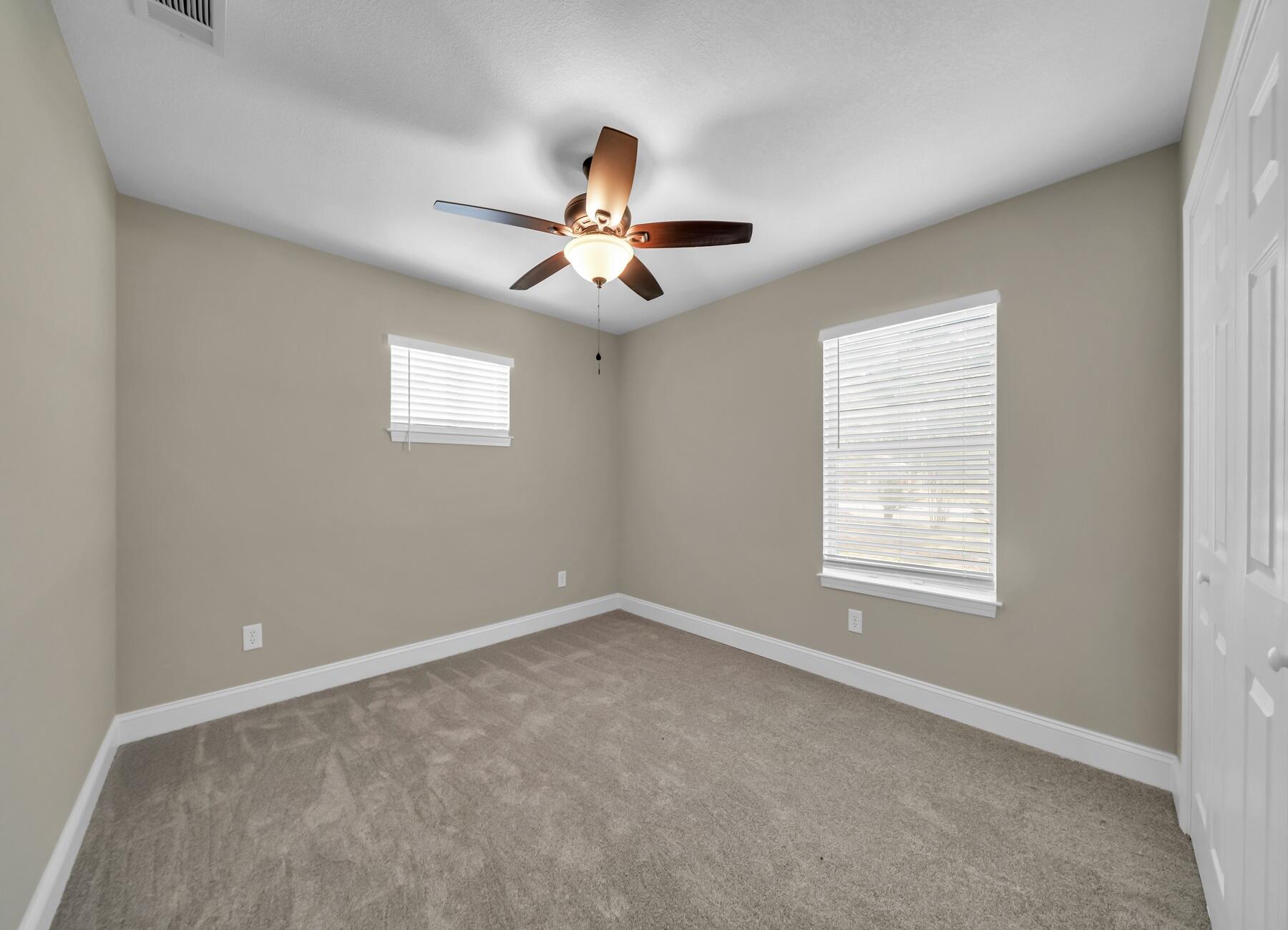 6935 Jasper Street Navarre, FL 32566 - Photo 26 of 45 a view of an empty room with a window