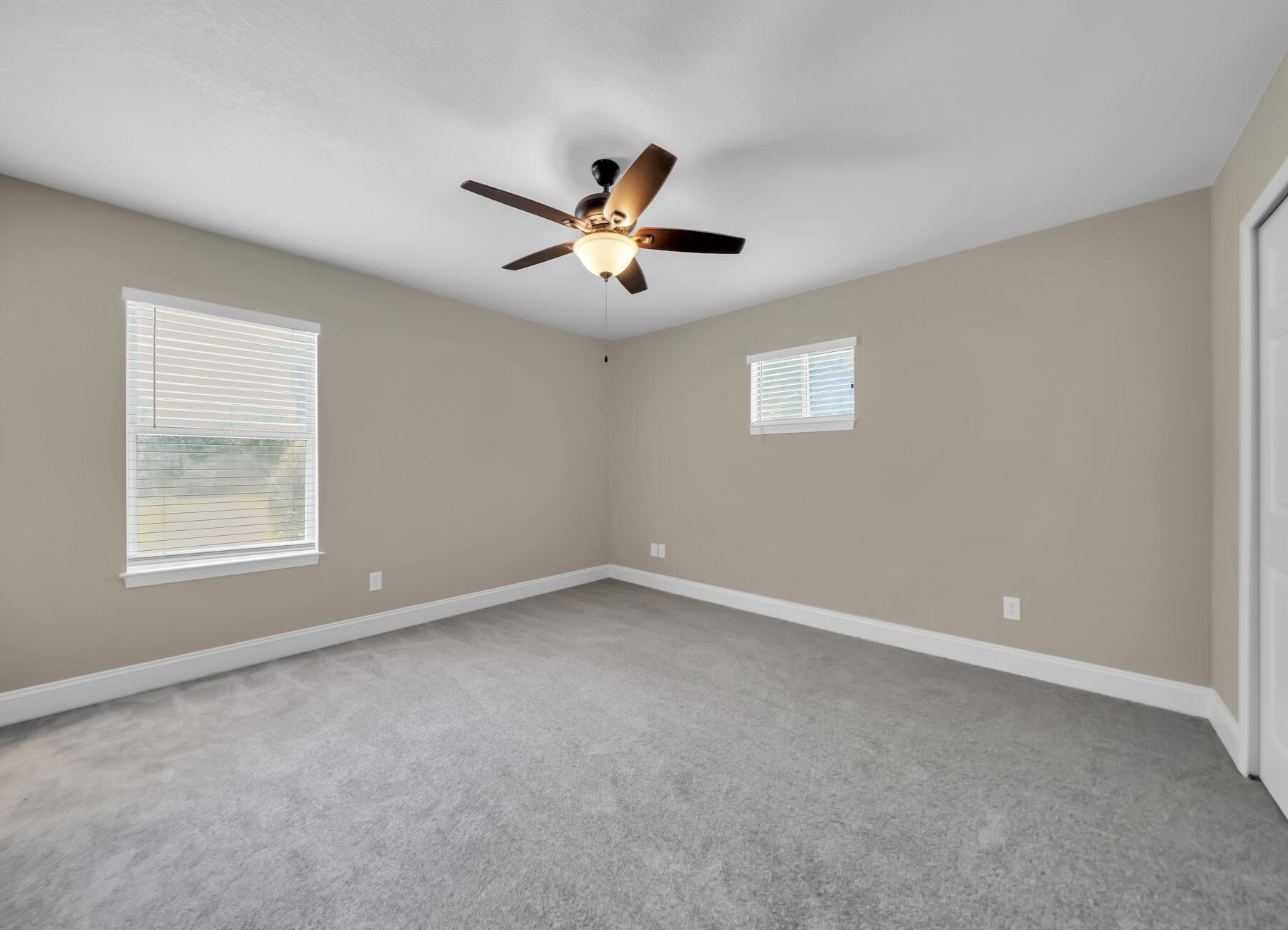 6935 Jasper Street Navarre, FL 32566 - Photo 28 of 45 a view of an empty room with a window