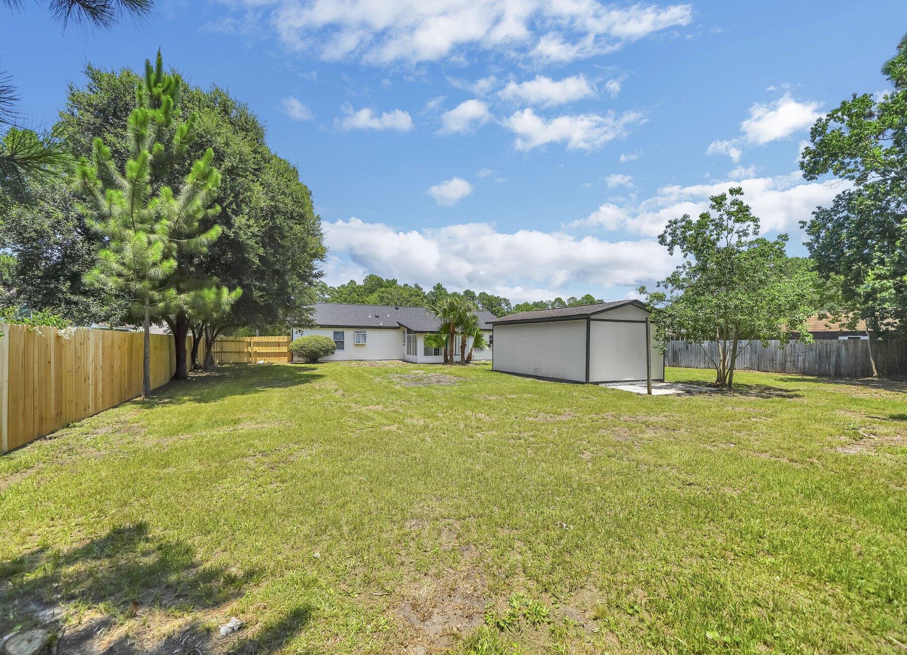 6935 Jasper Street Navarre, FL 32566 - Photo 40 of 45 a view of a backyard