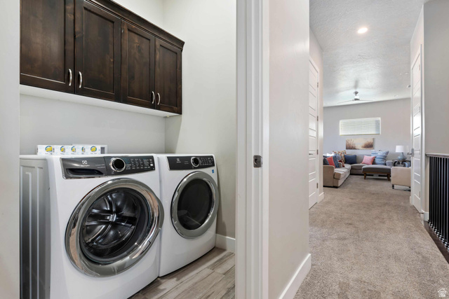 2600 Ocotillo Way, Unit 31 Santa Clara, UT 84765 - Photo 34 of 73 Dedicated laundry area featuring dark wood-finish cabinetry