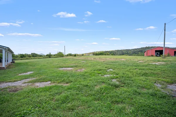 a view of a golf course with a big yard