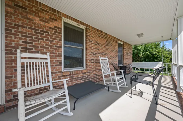 a patio with table and chairs
