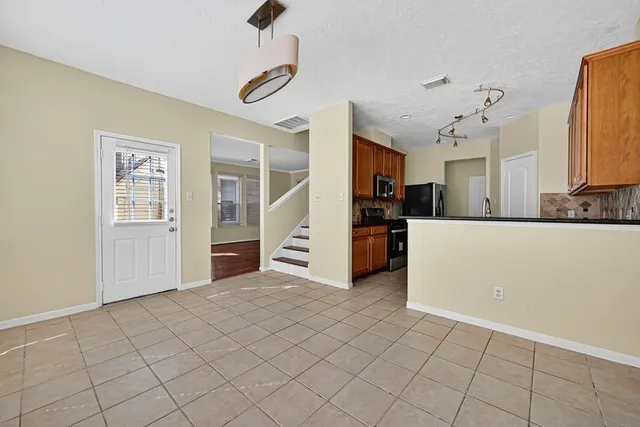 a view of a kitchen with furniture and cabinets