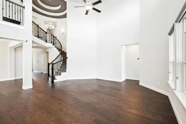 a view of an entryway with wooden floor