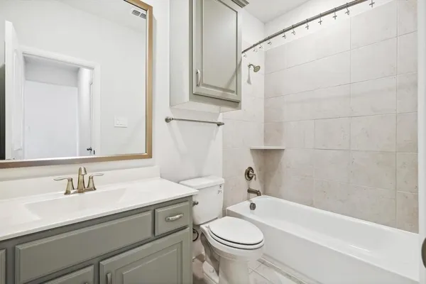 a bathroom with a sink toilet a mirror and shower