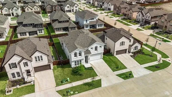 an aerial view of a house with garden