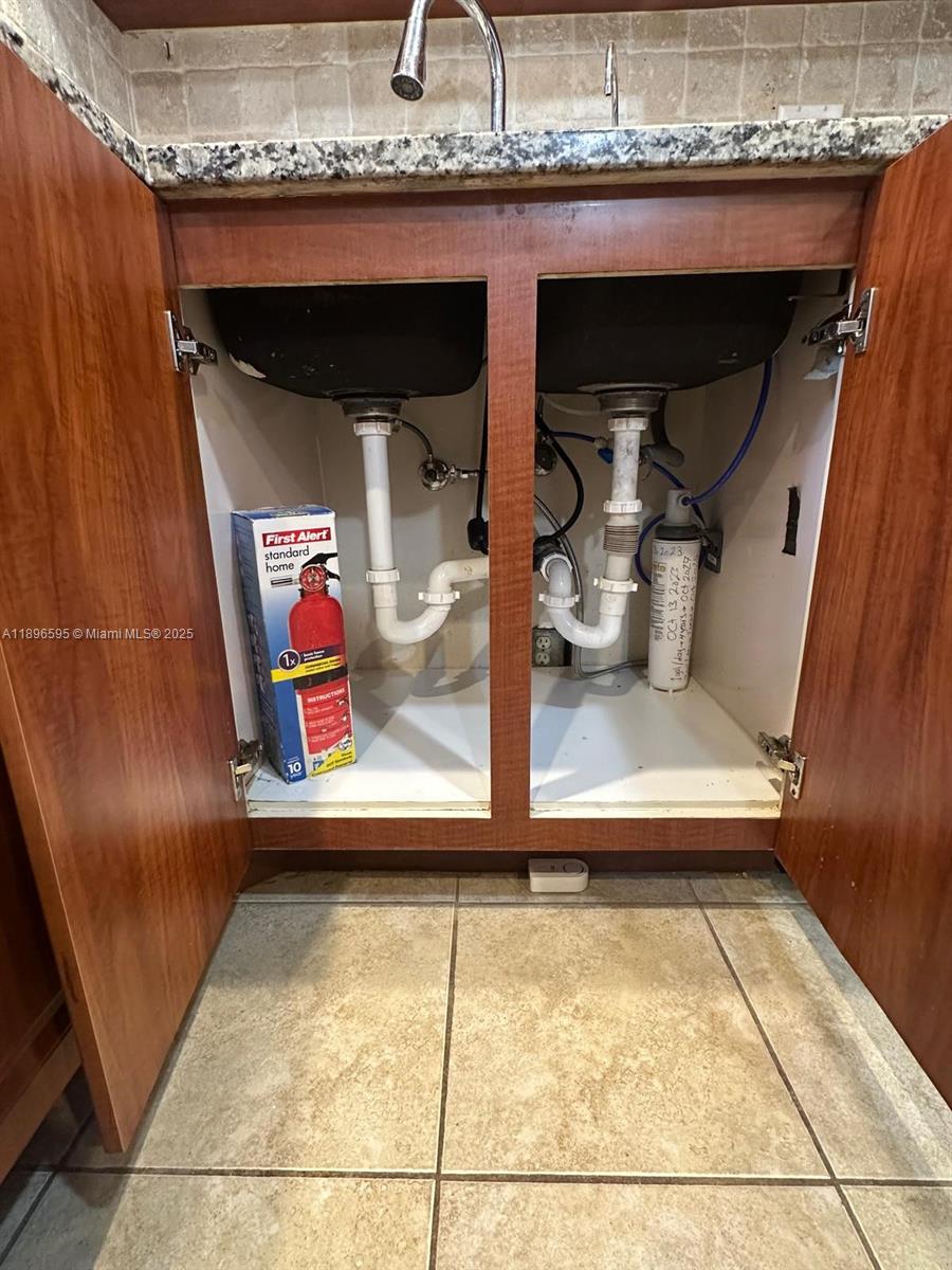 9848 Marina Boulevard, Unit 811 Boca Raton, FL 33428 - Photo 11 of 87 Under the kitchen sink