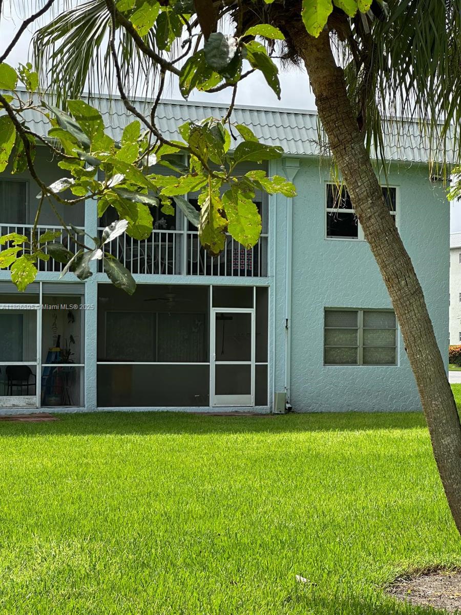 9848 Marina Boulevard, Unit 811 Boca Raton, FL 33428 - Photo 35 of 87 a view of house with a yard