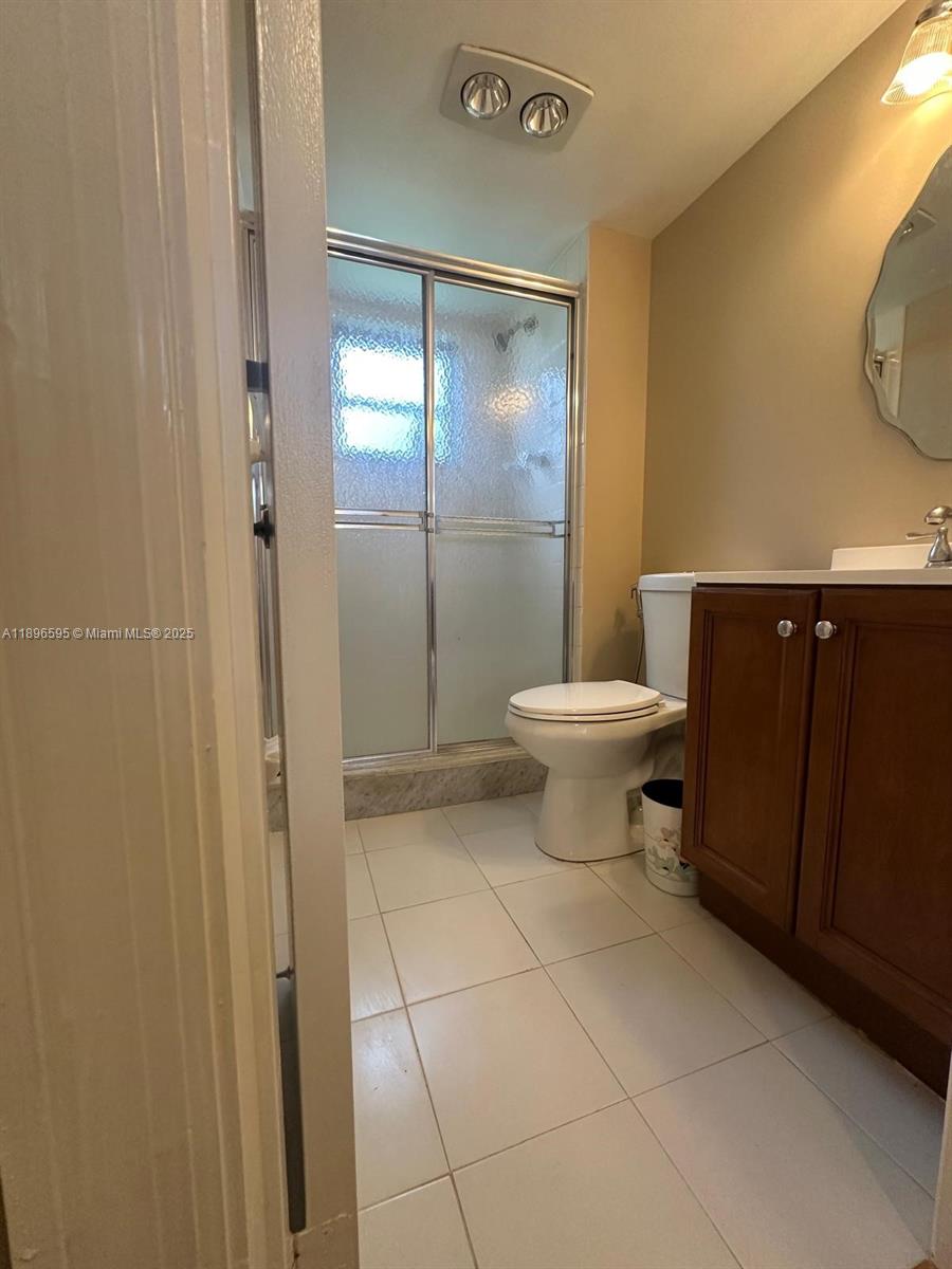 9848 Marina Boulevard, Unit 811 Boca Raton, FL 33428 - Photo 46 of 87 a bathroom with a toilet and a sink