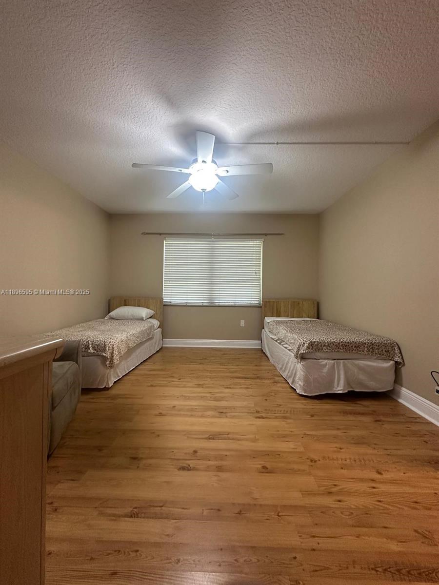 9848 Marina Boulevard, Unit 811 Boca Raton, FL 33428 - Photo 52 of 87 a bedroom with a bed and window