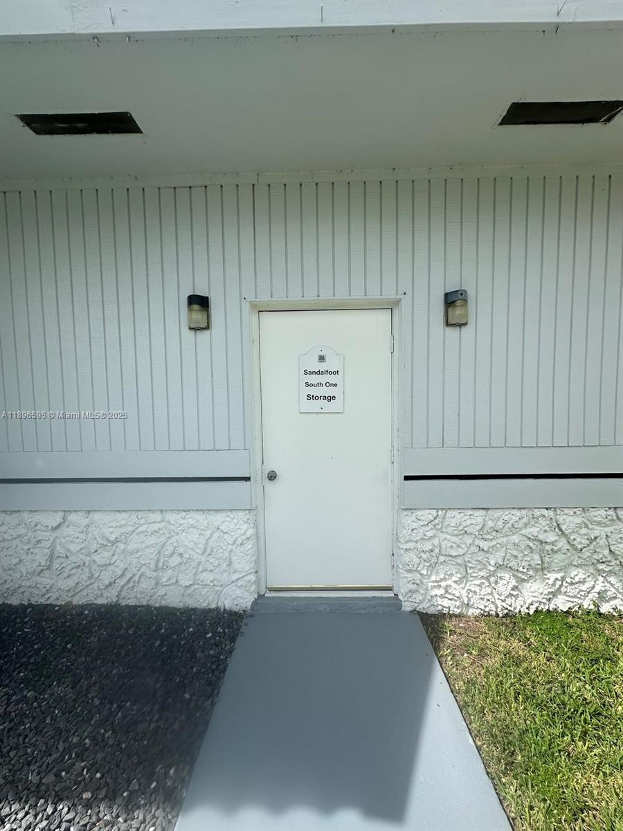 9848 Marina Boulevard, Unit 811 Boca Raton, FL 33428 - Photo 70 of 87 a view of wooden door