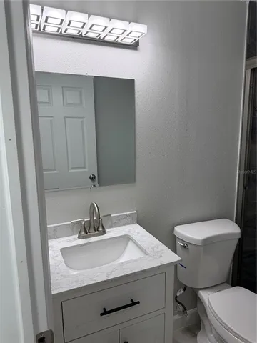 an empty room with a empty space and windows