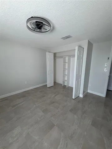 a bathroom with a toilet sink and a mirror