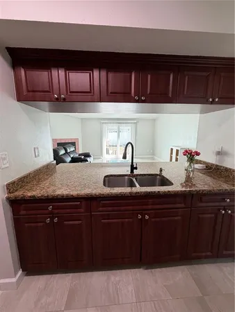 a kitchen with a sink and cabinets