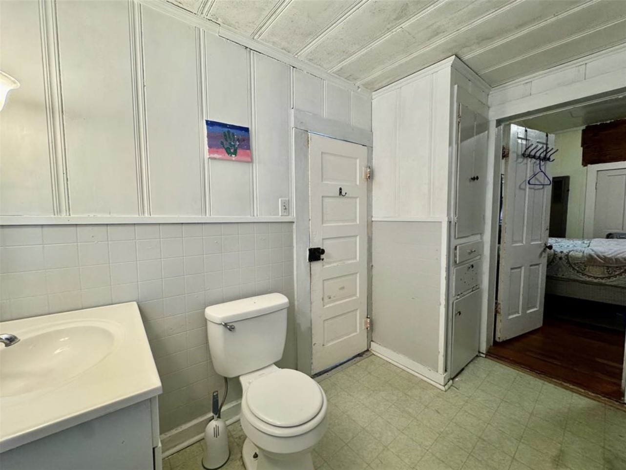 188 Elm Street Blessing, TX 77419 - Photo 12 of 19 a white toilet sitting next to a bathroom sink