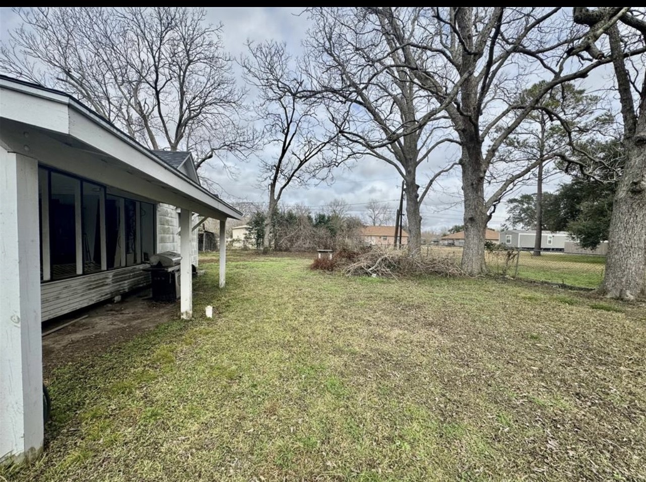 188 Elm Street Blessing, TX 77419 - Photo 19 of 19 a view of a house with a yard