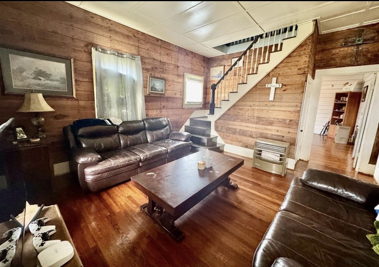 188 Elm Street Blessing, TX 77419 - Photo 2 of 19 a living room with furniture and wooden floor