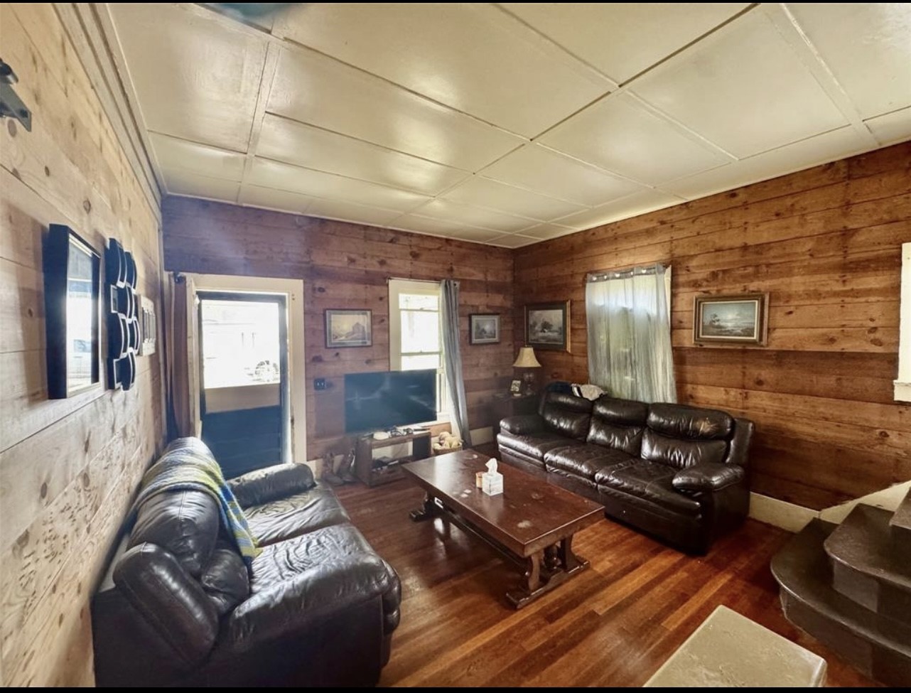 188 Elm Street Blessing, TX 77419 - Photo 3 of 19 a living room with furniture fireplace and flat screen tv