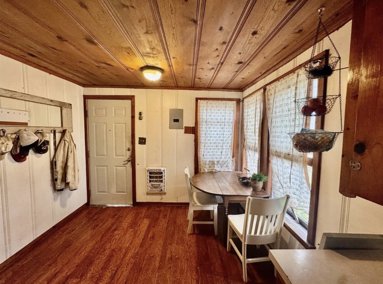 188 Elm Street Blessing, TX 77419 - Photo 6 of 19 a dining room with furniture and wooden floor