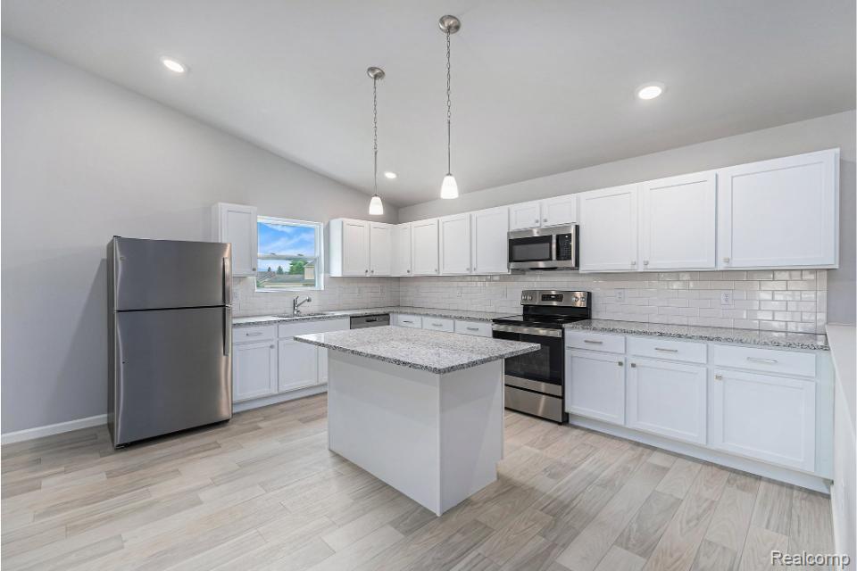 250 Joy Road Adrian, MI 49221 - Photo 5 of 32 Granite counters, subway tile backsplash