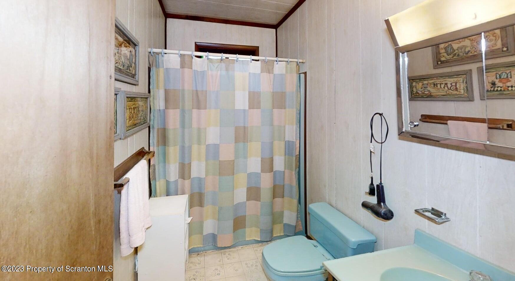 1144 Commanche Circle Lake Ariel, PA 18436 - Photo 16 of 28 a white toilet sitting next to a bathroom sink