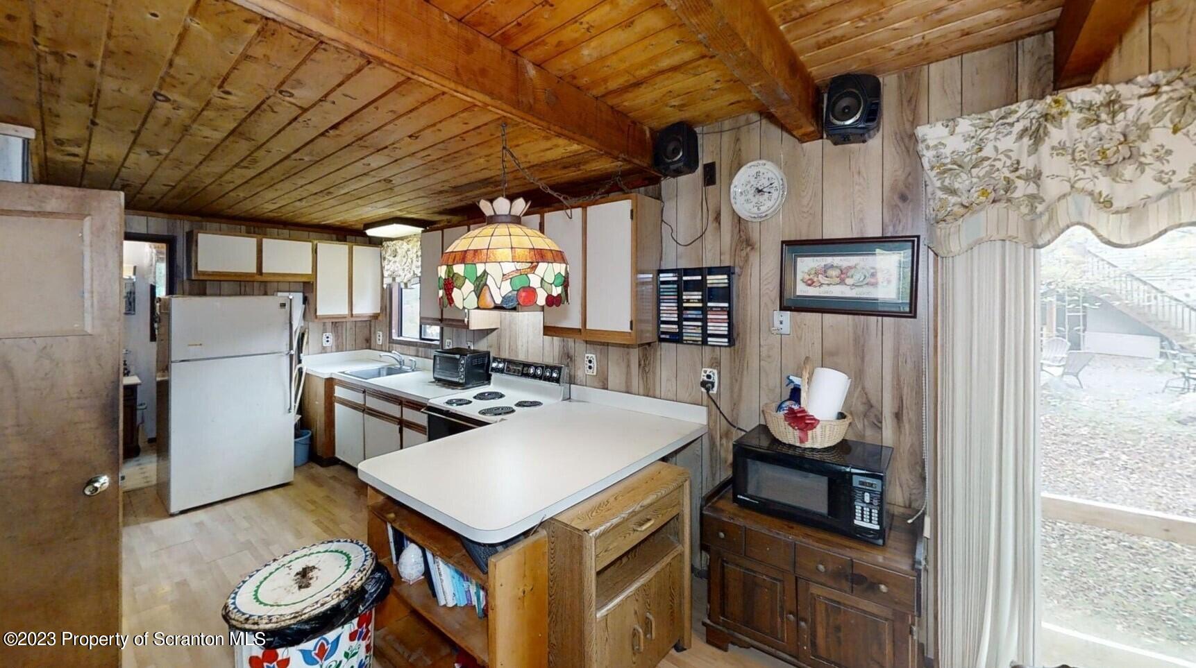 1144 Commanche Circle Lake Ariel, PA 18436 - Photo 18 of 28 a kitchen with stainless steel appliances granite countertop a sink a stove and a refrigerator