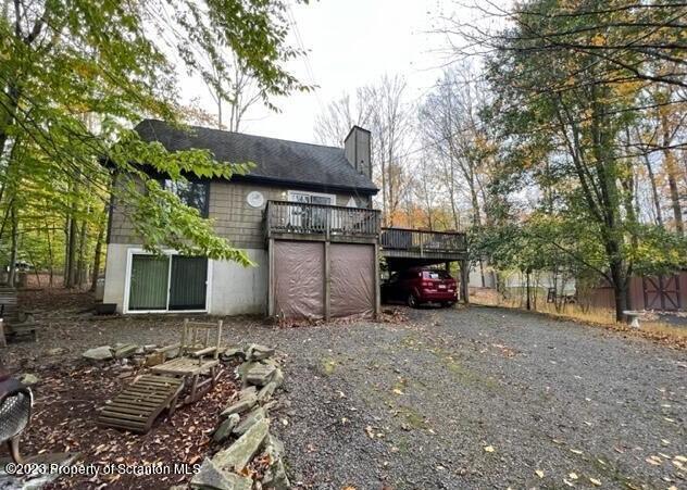 1144 Commanche Circle Lake Ariel, PA 18436 - Photo 2 of 28 a view of a house with a yard and a large tree