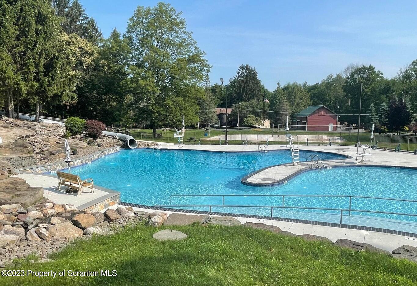1144 Commanche Circle Lake Ariel, PA 18436 - Photo 21 of 28 a view of a swimming pool with a yard