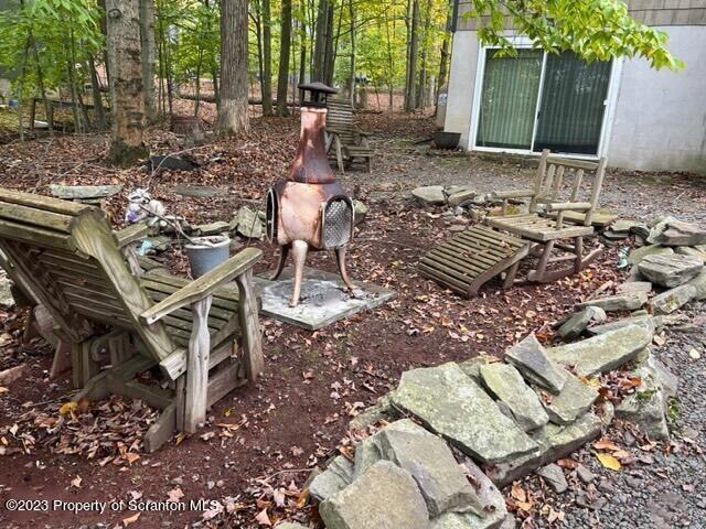 1144 Commanche Circle Lake Ariel, PA 18436 - Photo 5 of 28 a backyard of a house with table and chairs