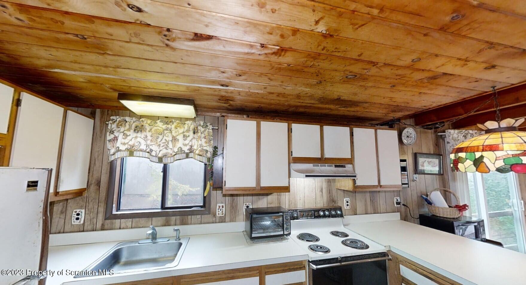 1144 Commanche Circle Lake Ariel, PA 18436 - Photo 6 of 28 a kitchen with a sink and a stove