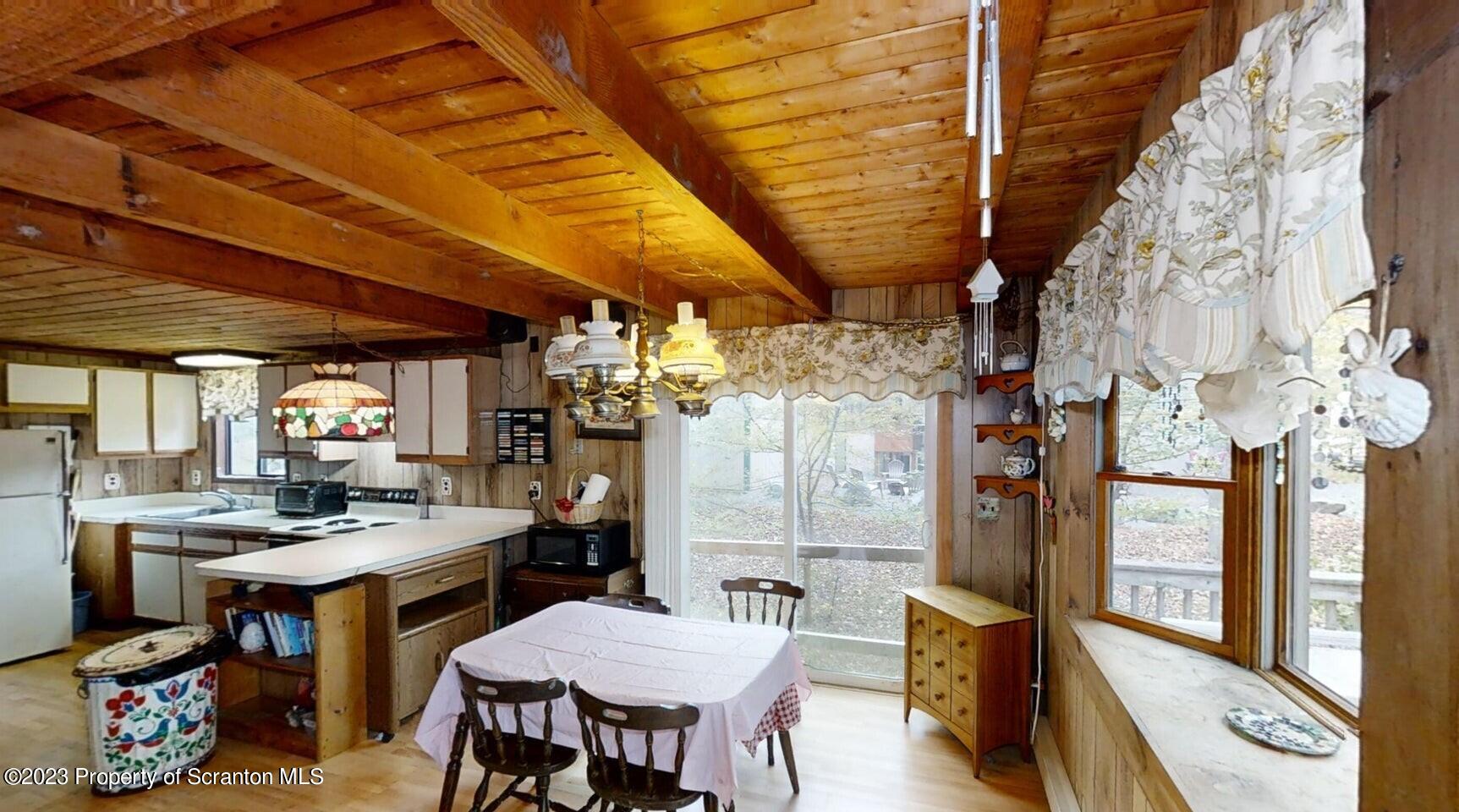 1144 Commanche Circle Lake Ariel, PA 18436 - Photo 7 of 28 a room with stainless steel appliances kitchen island granite countertop furniture and a chandelier