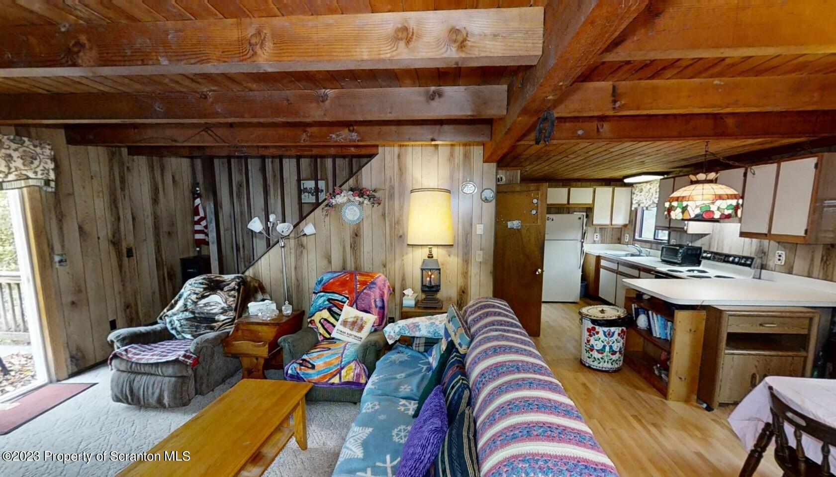 1144 Commanche Circle Lake Ariel, PA 18436 - Photo 8 of 28 a living room with furniture and a fireplace