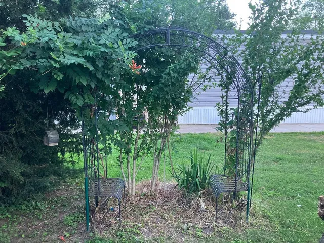 a view of a chairs setting in the deck in front of house