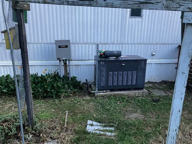 a view of a small house with a yard