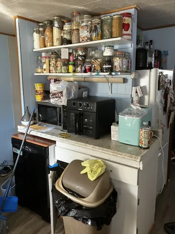 a kitchen with stainless steel appliances granite countertop a stove and a refrigerator