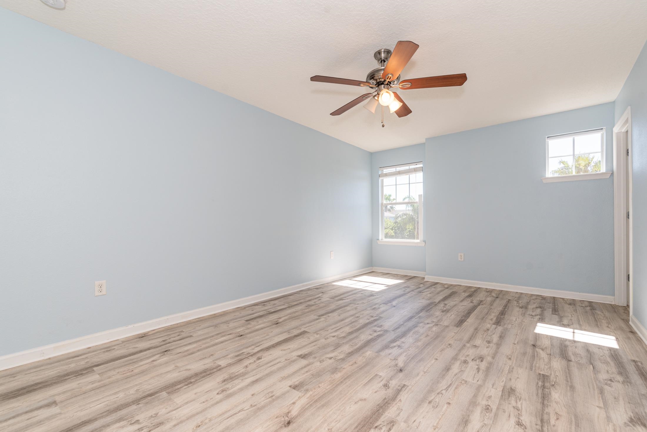 128 A Islander Circle St. Augustine, FL 32080 - Photo 13 of 26 wooden floor in an empty room with a window