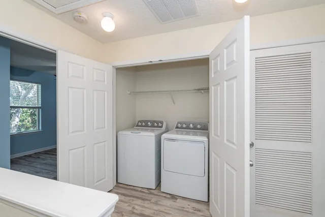 a utility room with dryer and washer