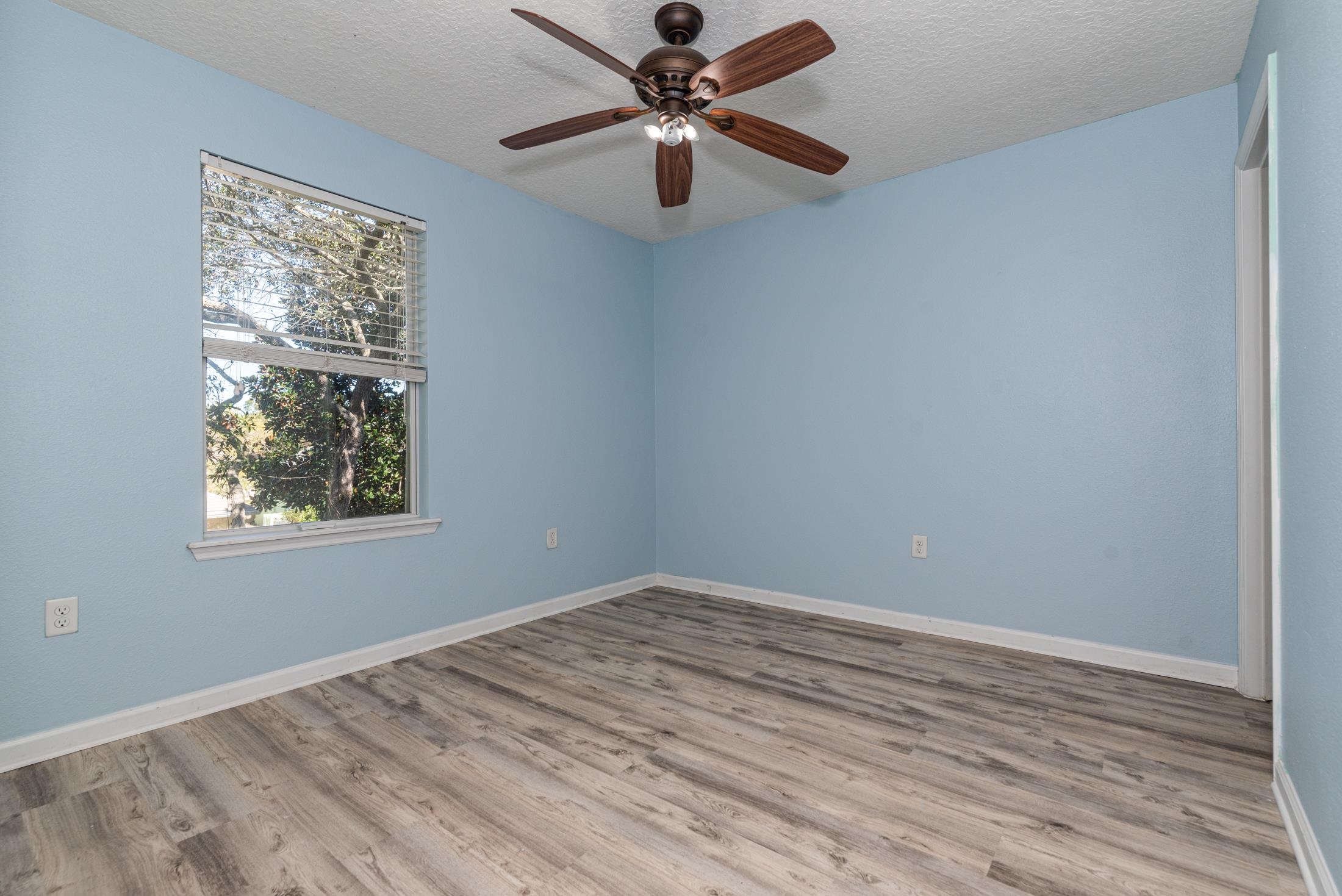 128 A Islander Circle St. Augustine, FL 32080 - Photo 18 of 26 a view of a big room with wooden floor and windows