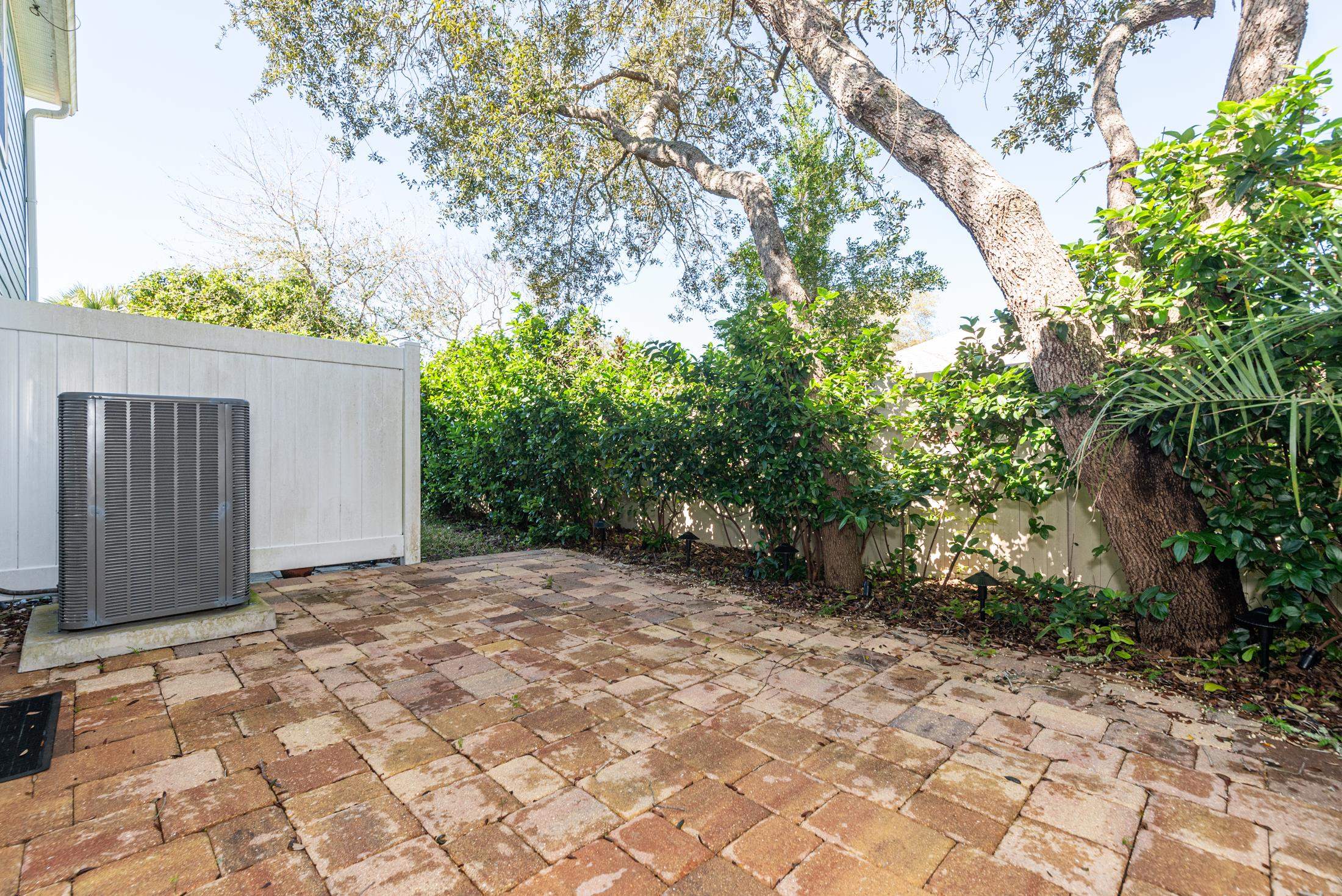 128 A Islander Circle St. Augustine, FL 32080 - Photo 23 of 26 a view of a yard with trees