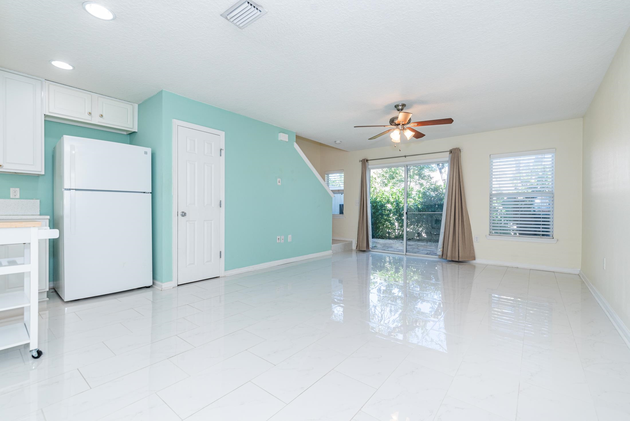 128 A Islander Circle St. Augustine, FL 32080 - Photo 5 of 26 a view of a livingroom with a ceiling fan and window