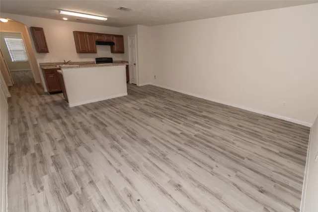 a view of kitchen with microwave oven and stove
