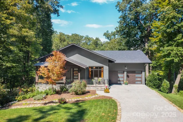 a front view of a house with a yard and porch