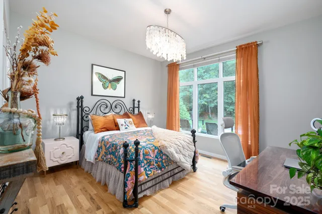 a bedroom with bed and a window