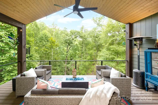 a balcony with furniture and a garden